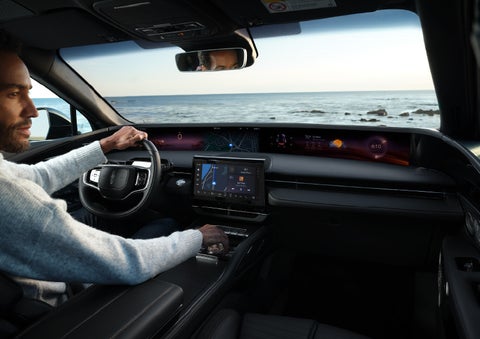A driver of a parked 2024 Lincoln Nautilus® SUV takes a relaxing moment at a seaside overlook while inside his Nautilus. | McKie Lincoln, Inc. in Rapid City SD
